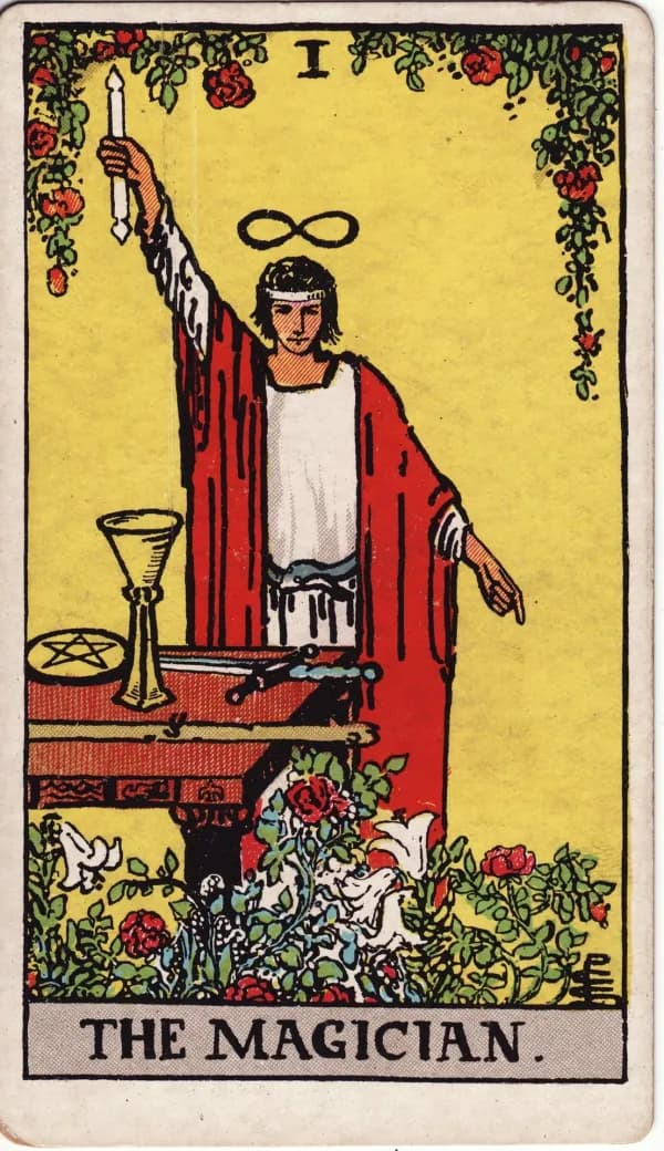 The Magician card from the Rider-Waite-Smith deck in red robes with golden details